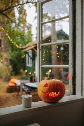 Carved pumpkin on window sill