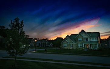 Sunsetting over residential home in suburban neighborhood
