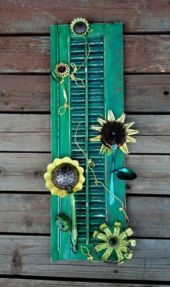 Wall art created out of an old green shutter