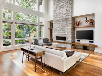 living room with picture window and fireplace