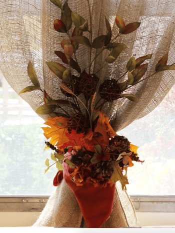 fall decorations around window curtain