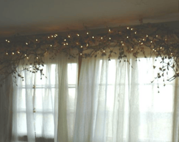 Rustic window dressings with white Christmas lights