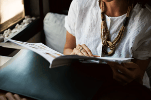 woman reading on sofa