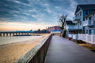 House on the boardwalk and the shore of the Chesapeake Bay, in North Beach, Maryland.