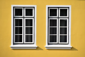 tinted windows in yellow building